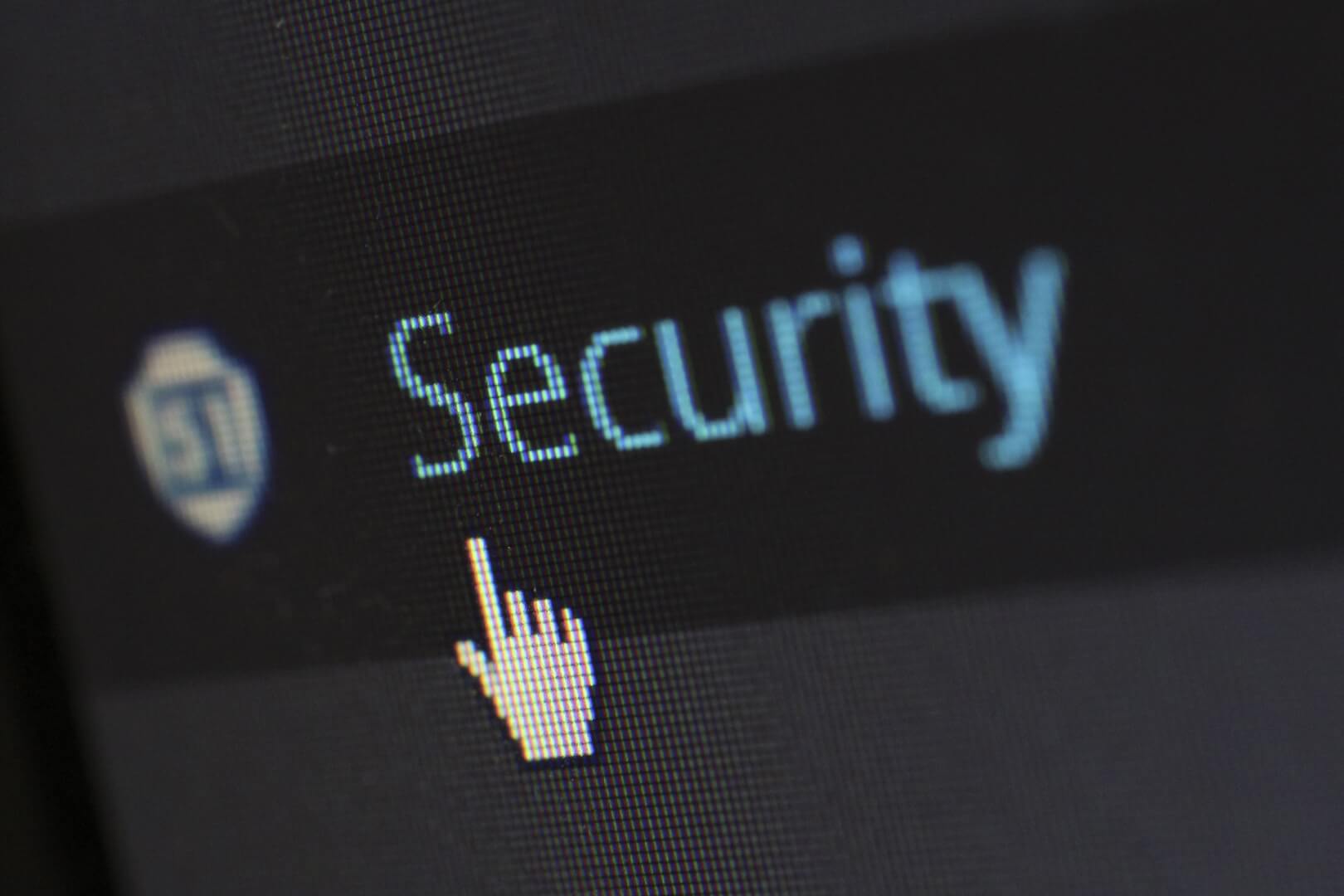 picture of a computer cursor hovering over a button entitled "Security"